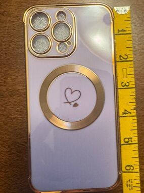 Source Unknown Light Purple Phone Case with Gold Ring and Heart Accent iPhone 15